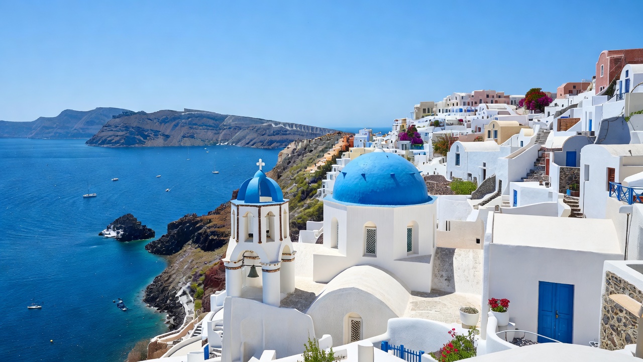 Santorini blue dome overlooking the Aegean sea in Oia Greece